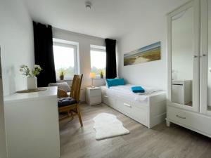 Posezení v ubytování Strandhaus-Nordseebrandung-Fewo-A2-3