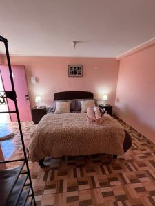 Postel nebo postele na pokoji v ubytování Hostal el hermanito