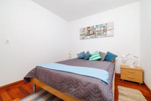 Postel nebo postele na pokoji v ubytování Apartment Helena