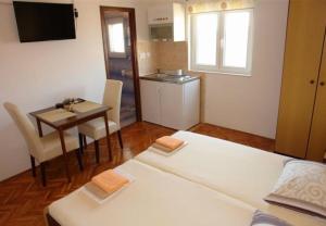 Kuchyňa alebo kuchynka v ubytovaní Apartments Ognjen