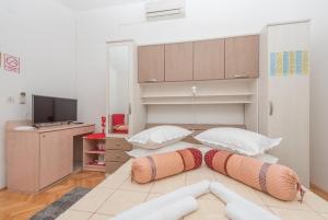 TV a/nebo společenská místnost v ubytování Apartments and Room Goran