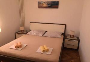 Posteľ alebo postele v izbe v ubytovaní Apartments Ognjen