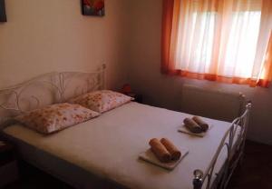 Posteľ alebo postele v izbe v ubytovaní Apartments Ognjen