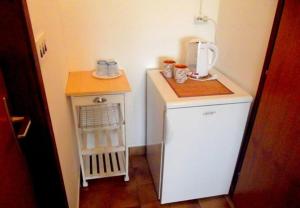 Kuchyňa alebo kuchynka v ubytovaní Apartments Ognjen
