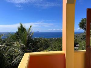 a view of the ocean from a balcony at Seaview Guesthouse Apt#1 in Bank Level