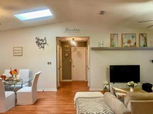 a living room with a couch and a table at Town & Country Getaway in Perkins