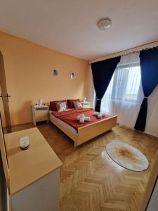 a bedroom with a bed and a large window at Apartment in Vidovac Cesaricki - Velebit Riviera 53369 in Vidovac