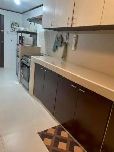 a kitchen with a sink and a counter top at Goras Haven in Iba