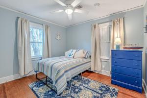 a bedroom with a bed and a blue dresser at Anchors Away in Park Circle with King Suite in Charleston +34 photos