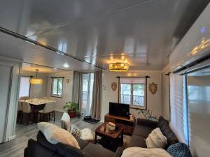 a living room with a couch and a table at Majuro Beachfront Container Home in Majuro