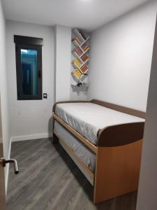 Ένα ή περισσότερα κρεβάτια σε δωμάτιο στο Fantástico apartamento con todos los servicios +44 φωτογραφίες