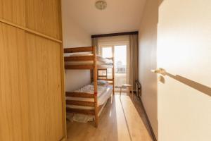 a room with two bunk beds and a door at Cadiz 0602 in Sint-Idesbald