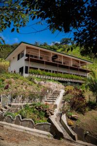 a house on top of a hill with stairs at Finca Aquarius in Monteverde Costa Rica