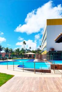 a view of a swimming pool at a building at Cobertura Duplex Pé na Areia 509 Tabatinga Residence in Conde