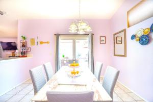 a dining room with a table and chairs at Private Guestrooms OR Entire Home Rental in North Las Vegas in Las Vegas +42 photos