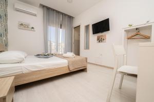 Central Room 128L客房内的一张或多张床位