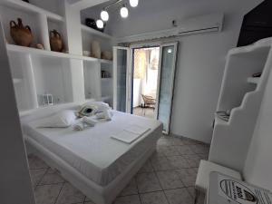Postel nebo postele na pokoji v ubytování Anoi Rooms