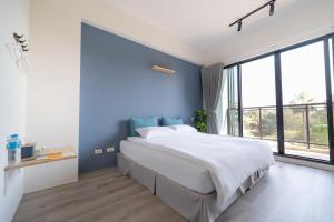 Postel nebo postele na pokoji v ubytování WuYou Guesthouse