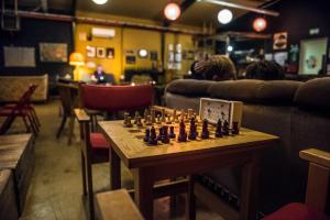 a chess board on a table in a room at The Freezer Hostel & Culture Center in Hellissandur