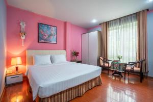 Postel nebo postele na pokoji v ubytování La Palma - Garden Saigon Hotel Phu My Hung