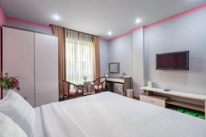 Postel nebo postele na pokoji v ubytování La Palma - Garden Saigon Hotel Phu My Hung