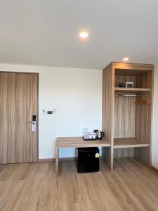 Kuchyň nebo kuchyňský kout v ubytování เวลโกรว์ โฮเทล - Wellgrow Hotel