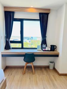 Příslušenství pro přípravu čaje a kávy v ubytování เวลโกรว์ โฮเทล - Wellgrow Hotel