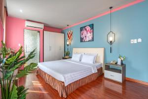 Postel nebo postele na pokoji v ubytování La Palma - Garden Saigon Hotel Phu My Hung