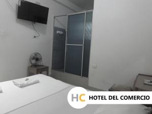 Voodi või voodid majutusasutuse Hotel del Comercio toas
