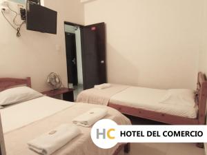 Voodi või voodid majutusasutuse Hotel del Comercio toas