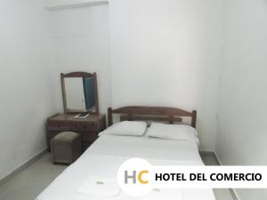 Voodi või voodid majutusasutuse Hotel del Comercio toas