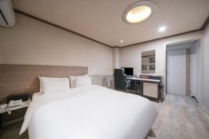 Ssum Hotel Suwon客房内的一张或多张床位