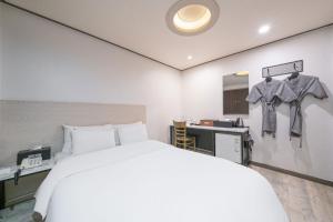 Ssum Hotel Suwon客房内的一张或多张床位