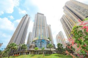 a group of tall buildings in a city at Eisei House in Jakarta