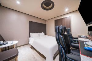 Ssum Hotel Suwon客房内的一张或多张床位