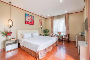 Postel nebo postele na pokoji v ubytování La Palma - Garden Saigon Hotel Phu My Hung