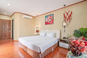 Postel nebo postele na pokoji v ubytování La Palma - Garden Saigon Hotel Phu My Hung