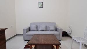 a living room with a couch and a coffee table at HSR layout Abode 2 in Bangalore