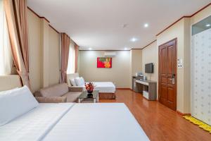 Postel nebo postele na pokoji v ubytování La Palma - Garden Saigon Hotel Phu My Hung