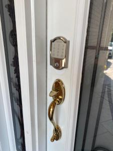 a door handle with a clock on it at F1 cozy Sunny room in Mississauga