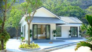 a house in the middle of a garden at Thiên Trường An Garden in Ninh Binh