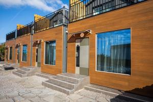 a building with stairs in front of it with a balcony at Neul Olle Stay in Jeju +18 photos