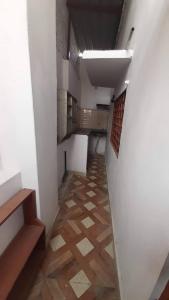 an empty room with a hallway with ailed floor at Kanha's Kunj in Prayagraj +11 photos