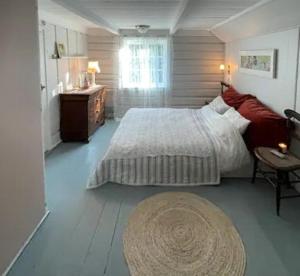 Ένα ή περισσότερα κρεβάτια σε δωμάτιο στο Charming Southern Style House Near Arendal