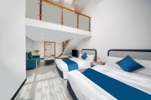 Guangzhou Youke Serviced Apartment1min to Line5 Taojin STN-Free shuttle bus during the Canton Fair客房内的一张或多张床位