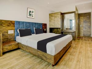 Postel nebo postele na pokoji v ubytování Super Townhouse Madgaon