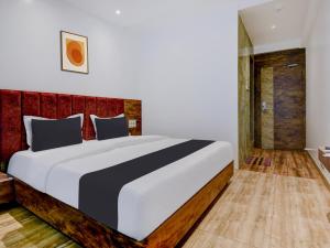 Postel nebo postele na pokoji v ubytování Super Townhouse Madgaon + 34 fotografií