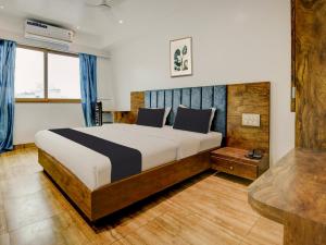 Postel nebo postele na pokoji v ubytování Super Townhouse Madgaon
