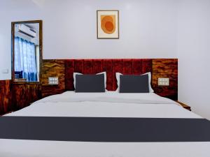 Postel nebo postele na pokoji v ubytování Super Townhouse Madgaon