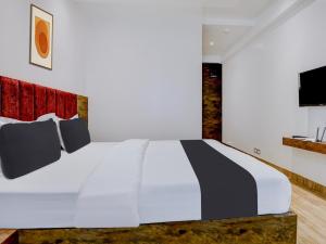 Postel nebo postele na pokoji v ubytování Super Townhouse Madgaon